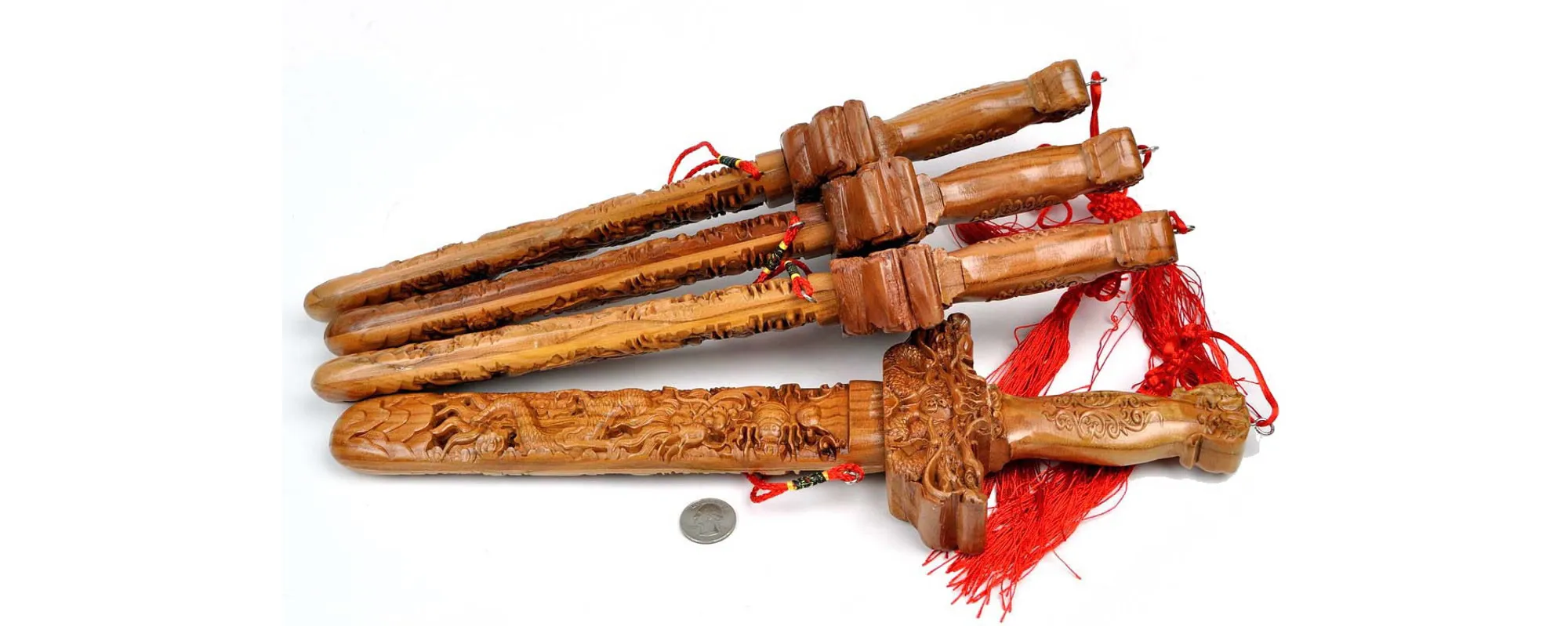 Crafting traditional peach wood swords, symbolizing protection and cultural heritage.